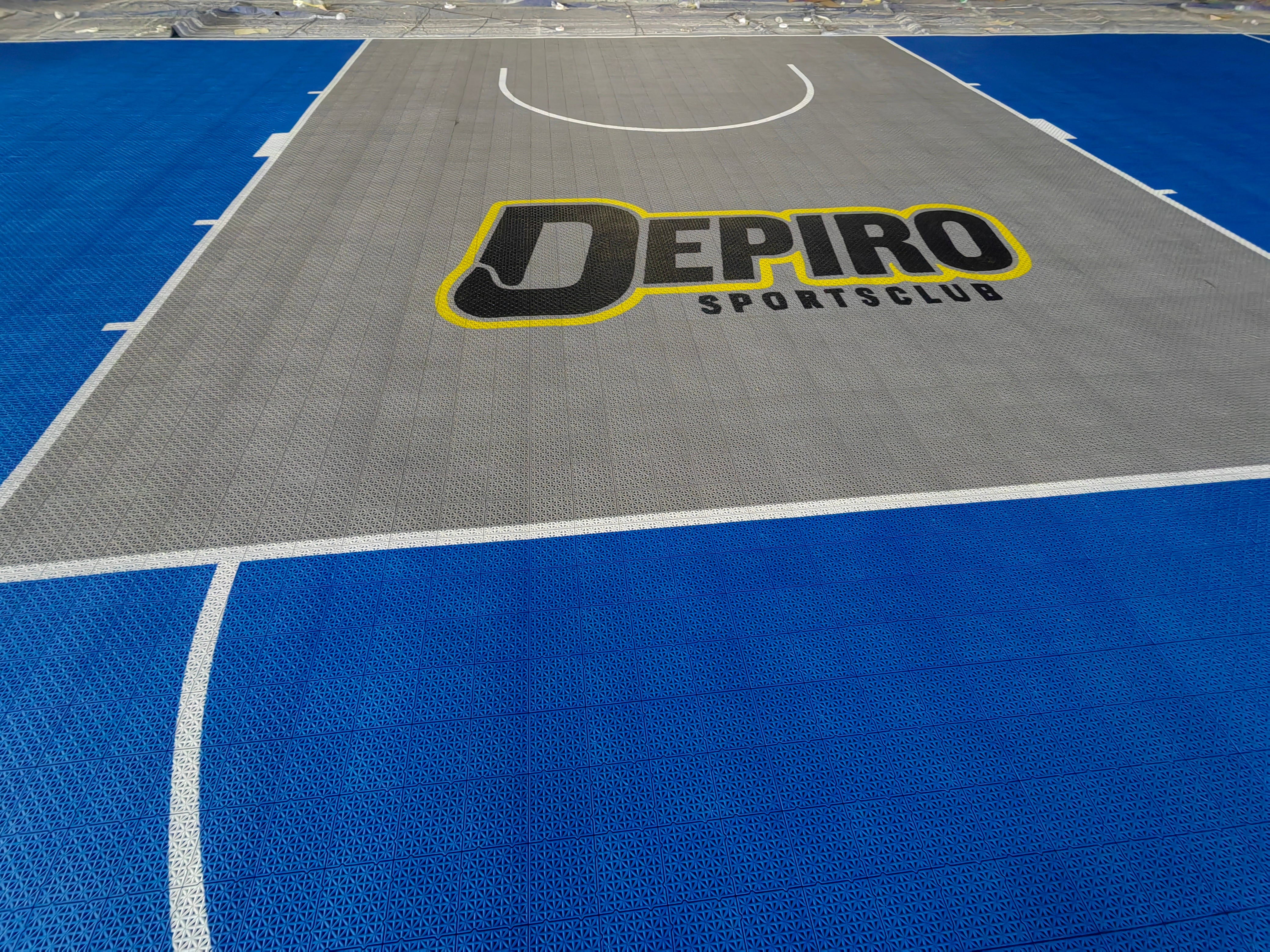 Depiro Sports logo printed across the gray basketball key