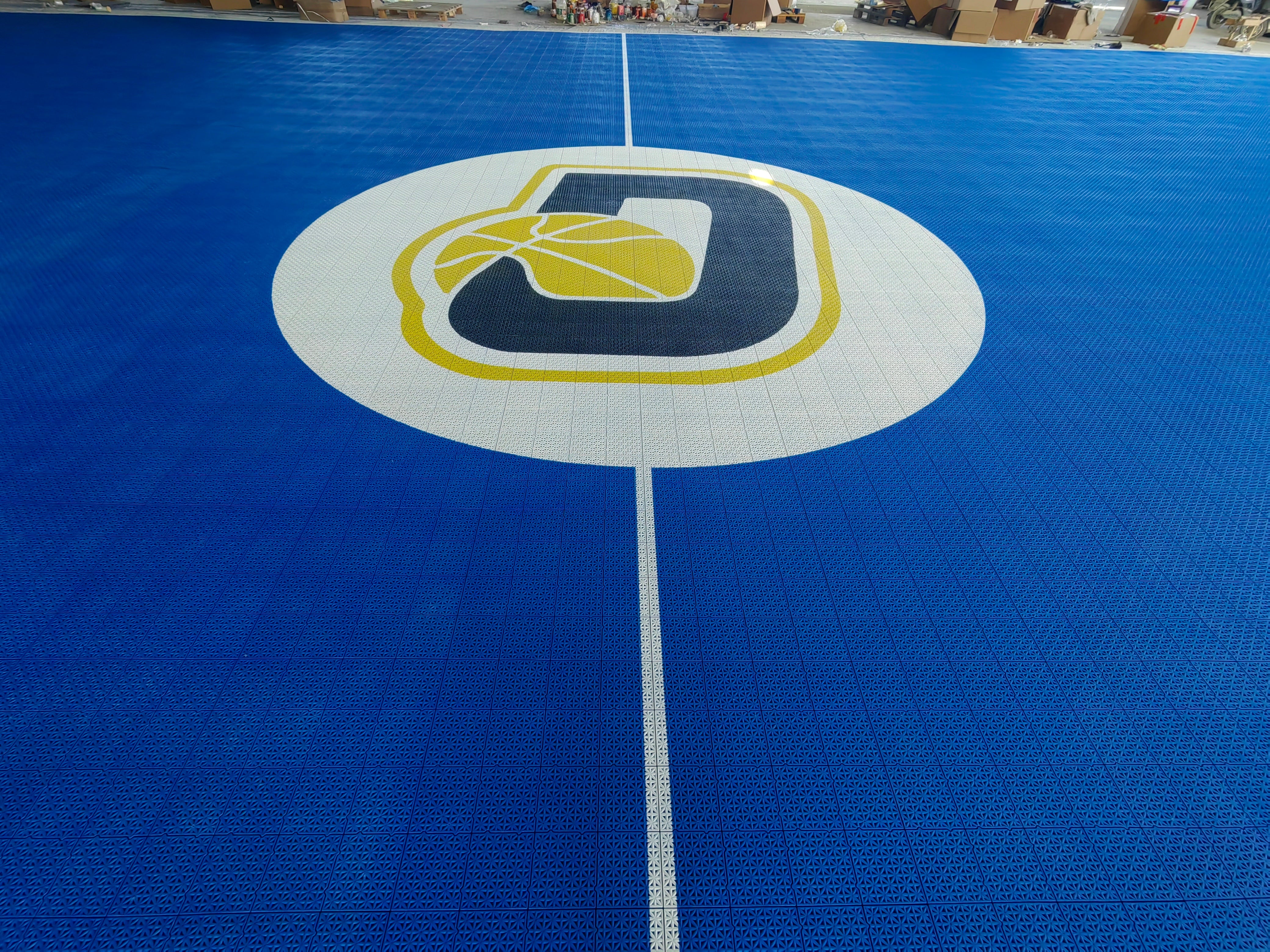 Custom Depiro basketball logo at the center of the blue court