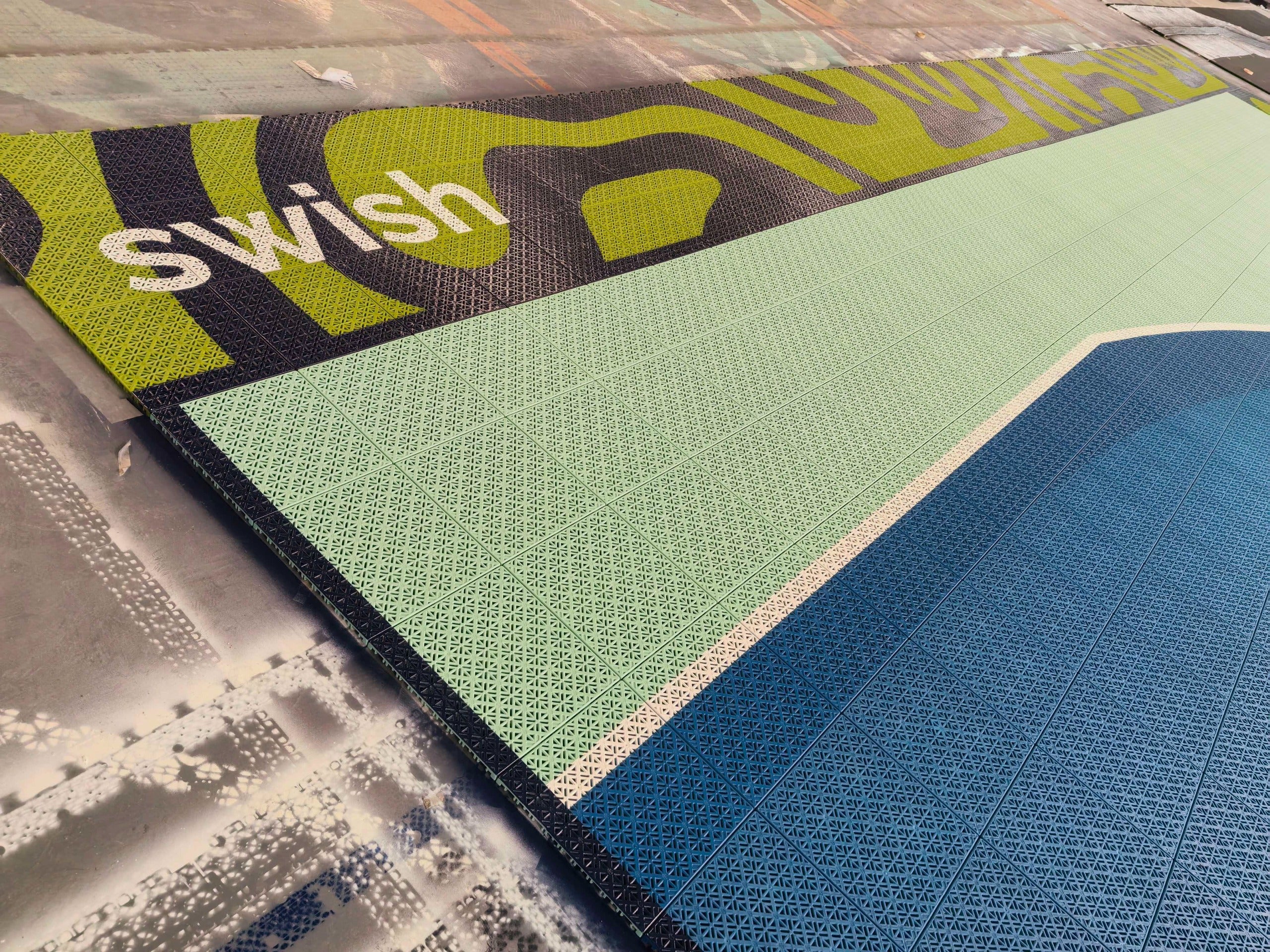 Swish branding within the charcoal and lime border artwork of the Elevate court