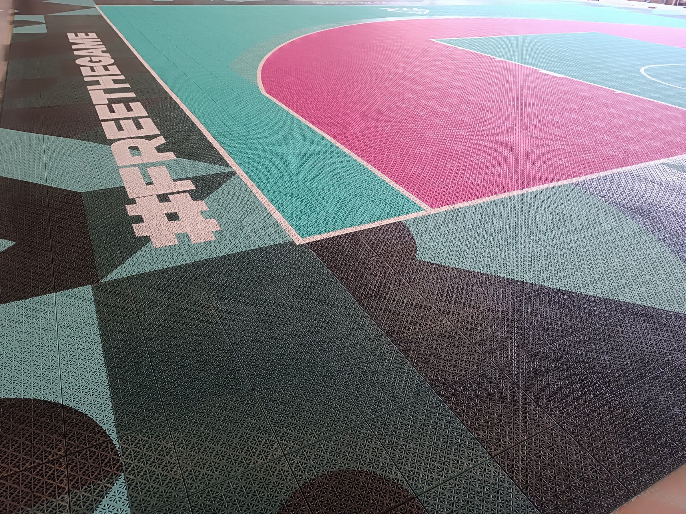 Free the Game border artwork on The 3x3 Academy basketball court