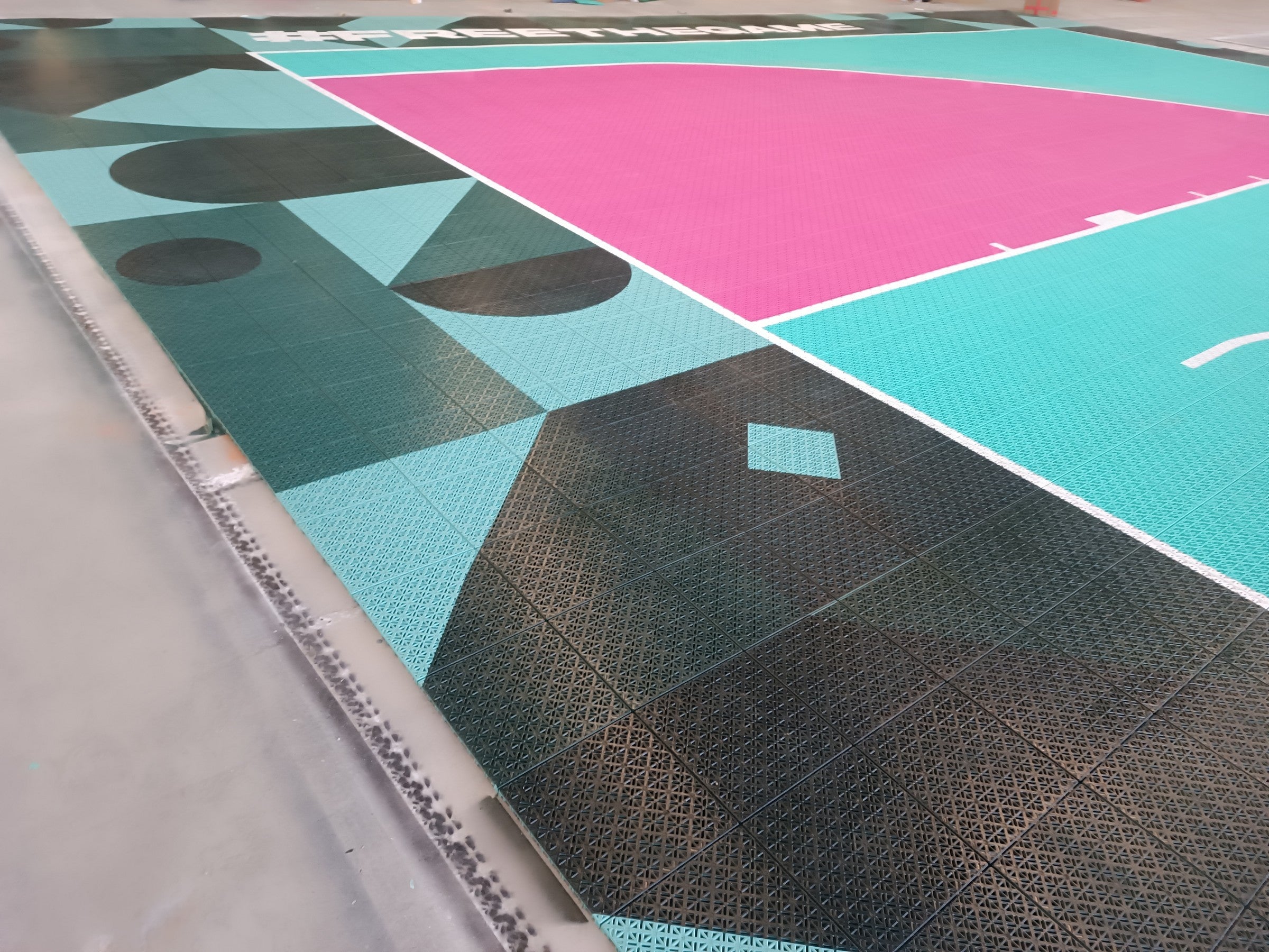 Custom sideline pattern and magenta arc on The 3x3 Academy court
