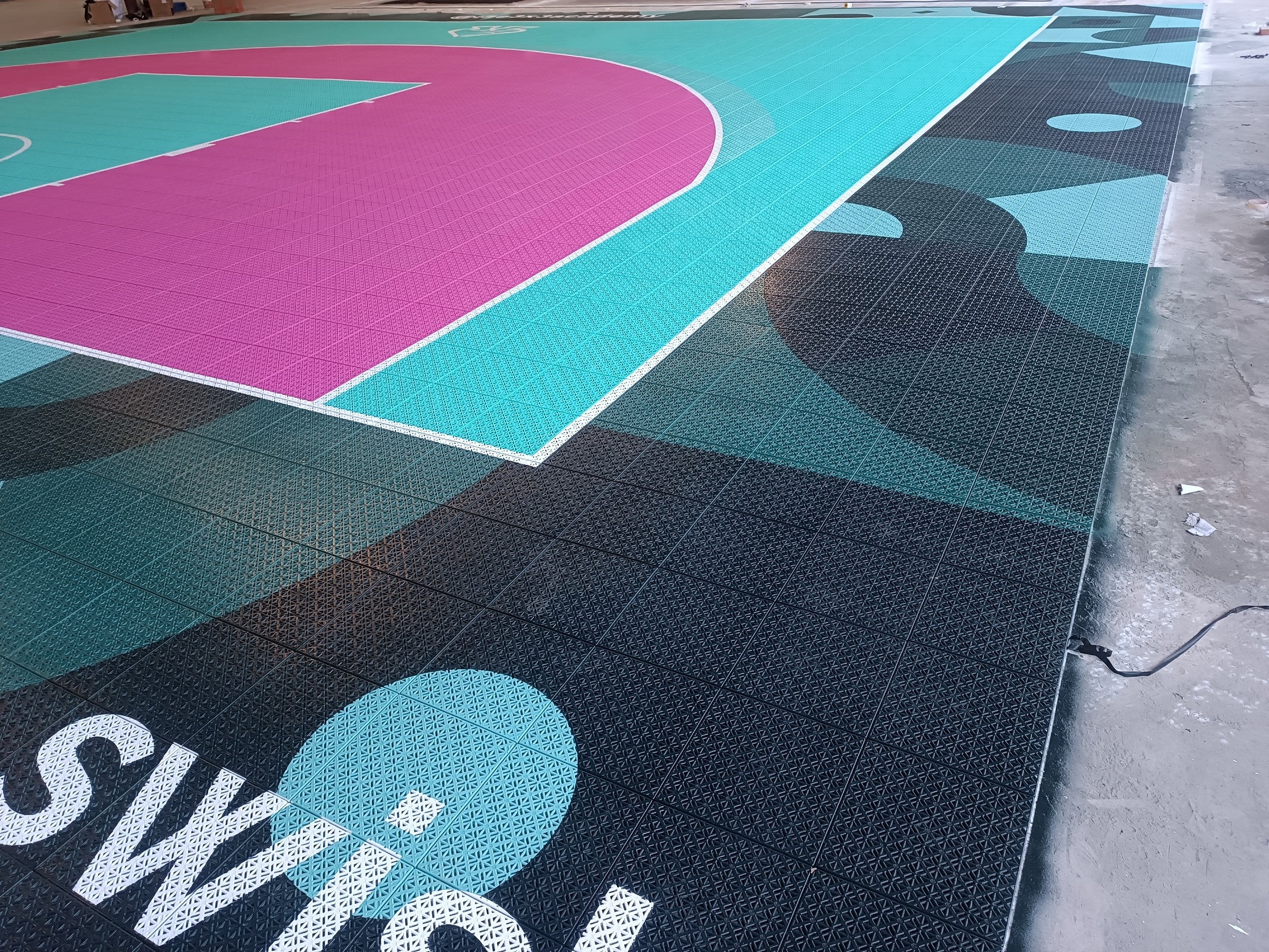 Swish branding and custom border detail on The 3x3 Academy court