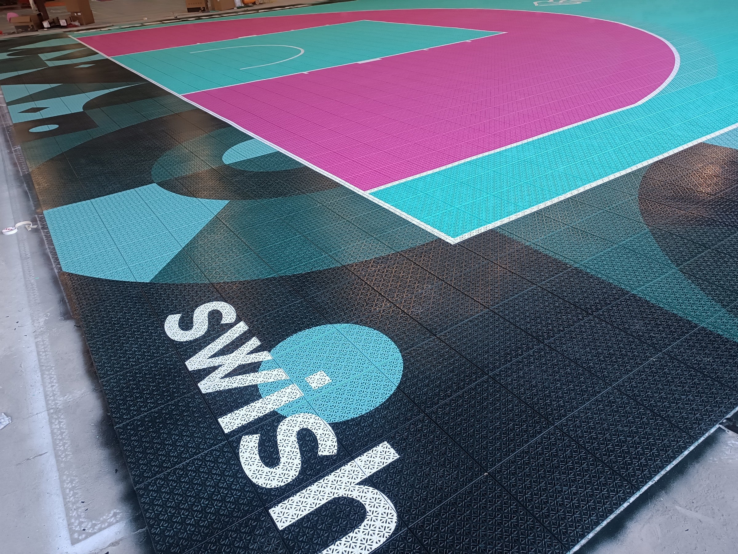 Wide view of the magenta arc and turquoise playing surface
