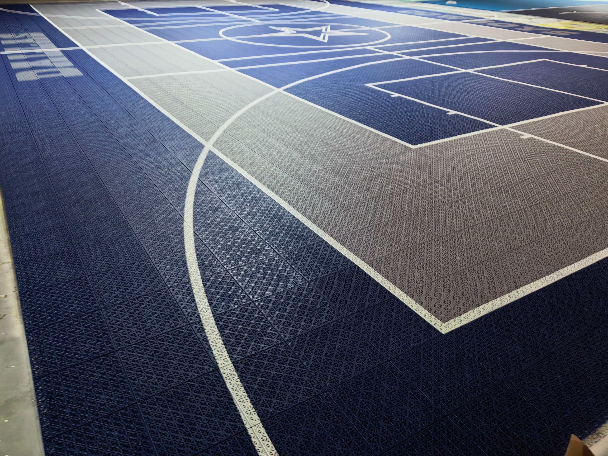 Close warehouse view of the Dallas court playing lines and modular Elastic tiles