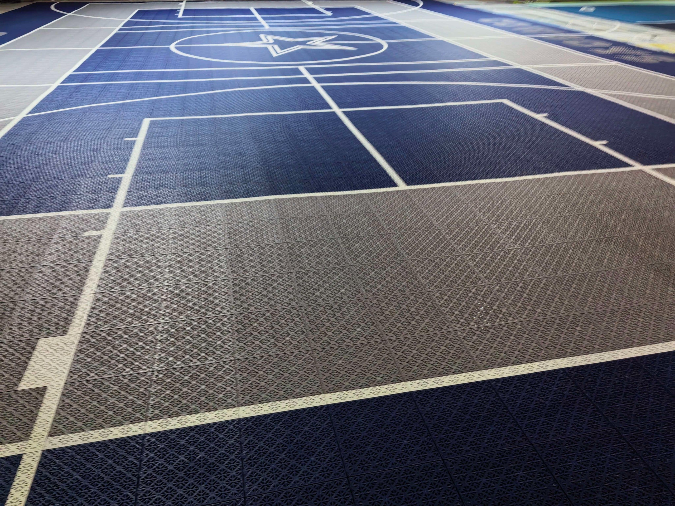 Navy key and silver playing area on the custom Dallas basketball court