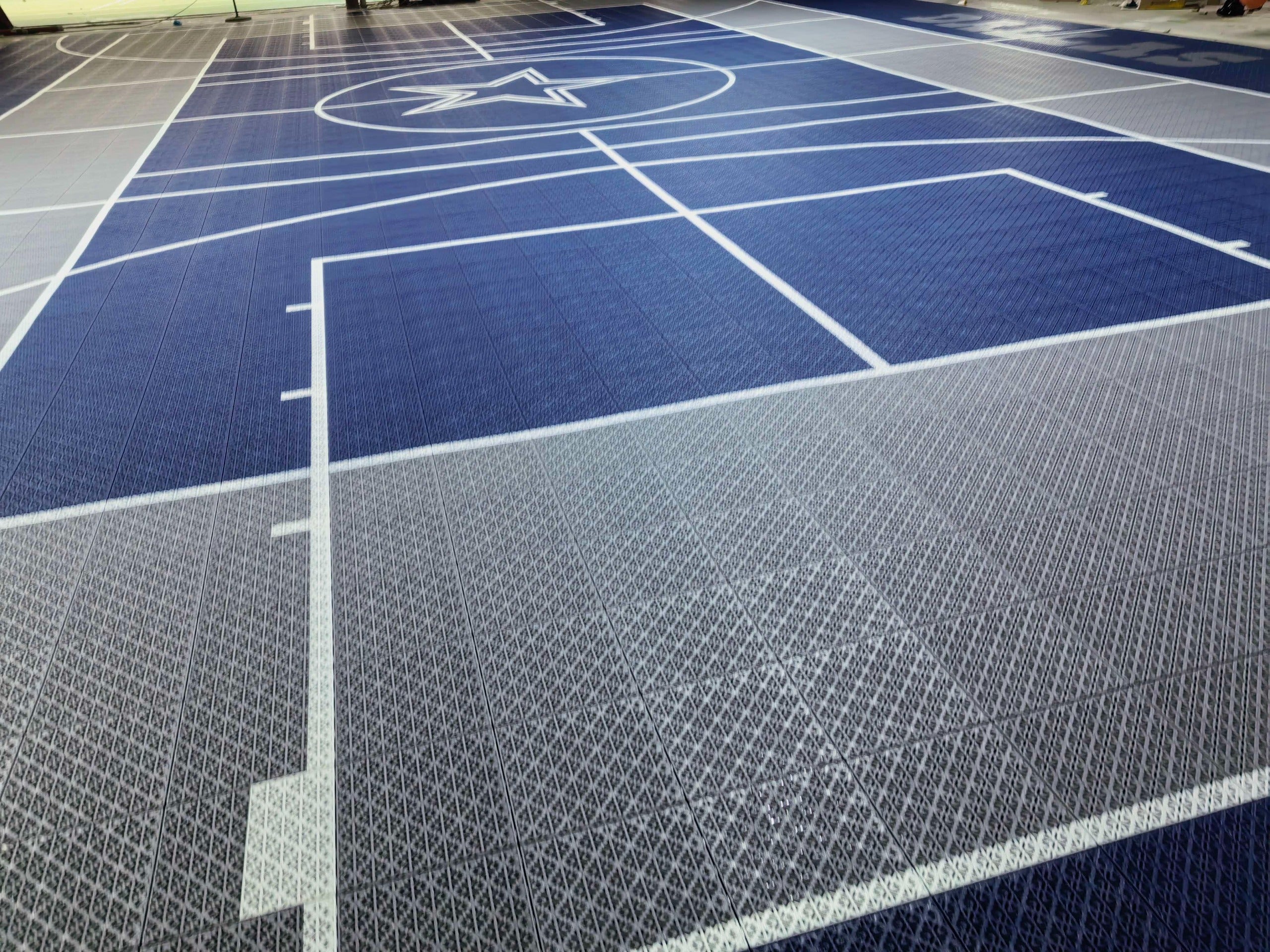 Wide warehouse view of the Dallas two-hoop Elastic tile court