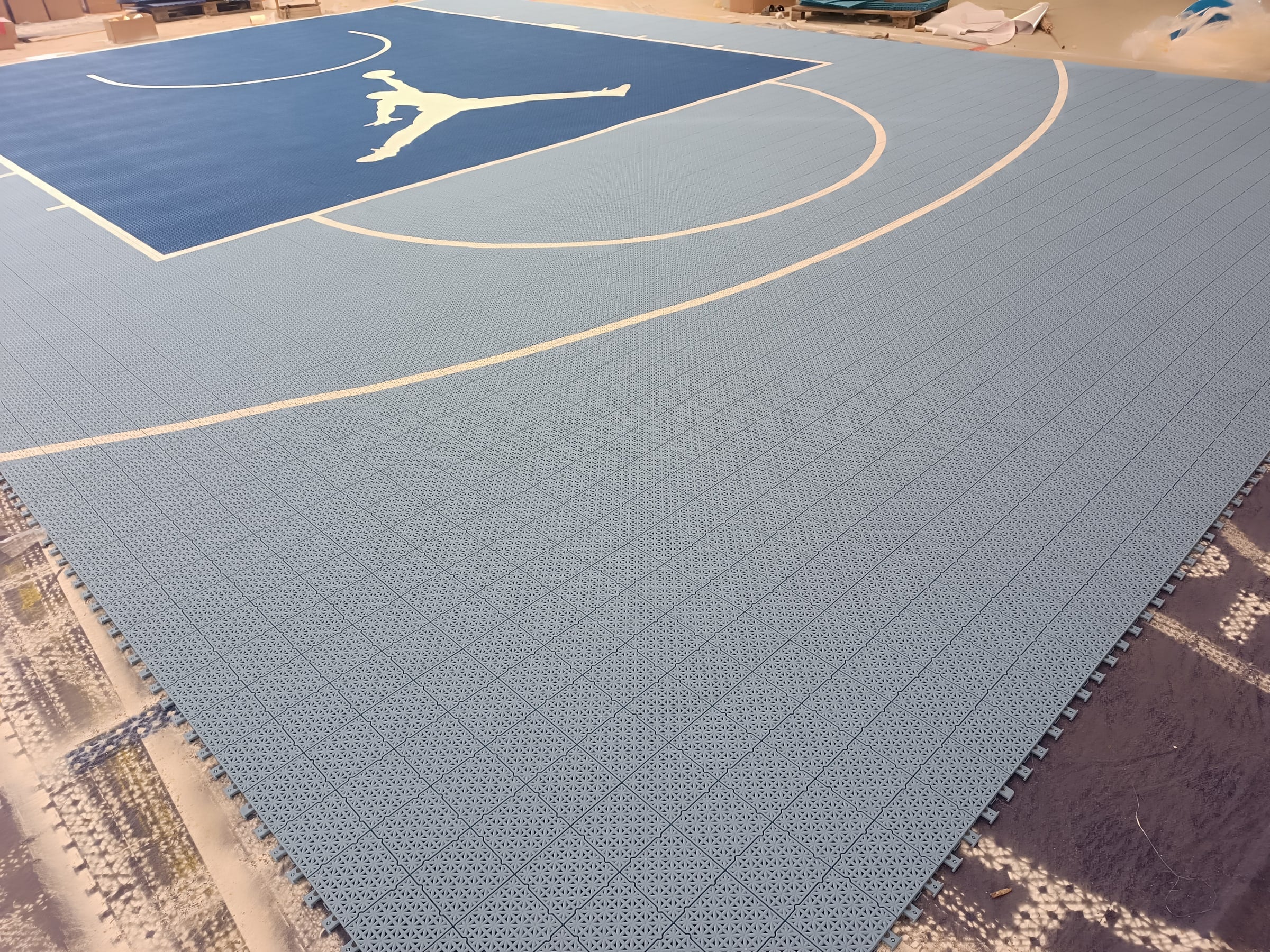 light blue and deep blue Jumpman one-hoop Large Elite tile backyard basketball court in France, project photo 2