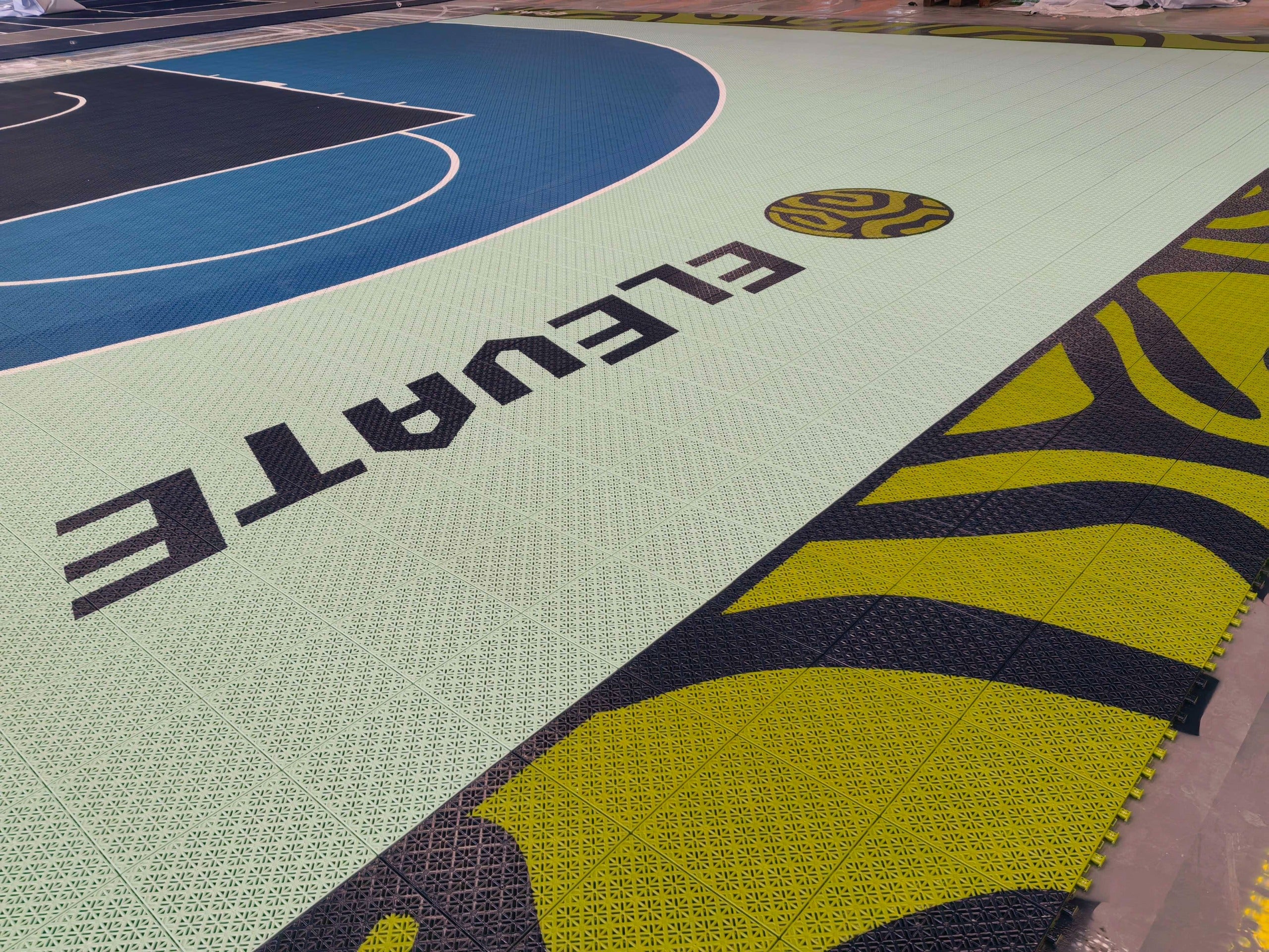 Elevate wordmark and circular logo across the custom mint court tiles