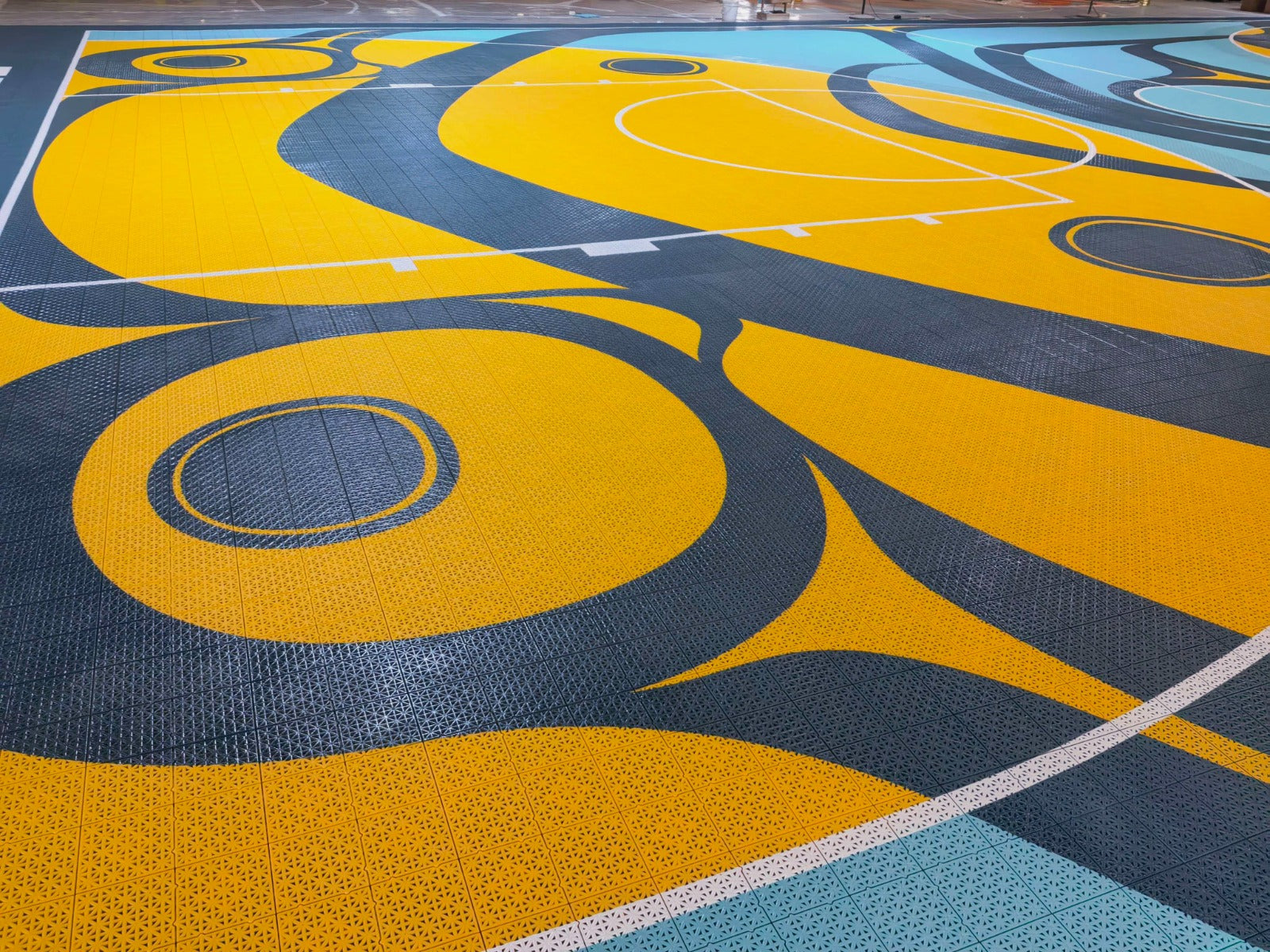 Yellow and dark teal custom artwork across the Elite tile playing surface