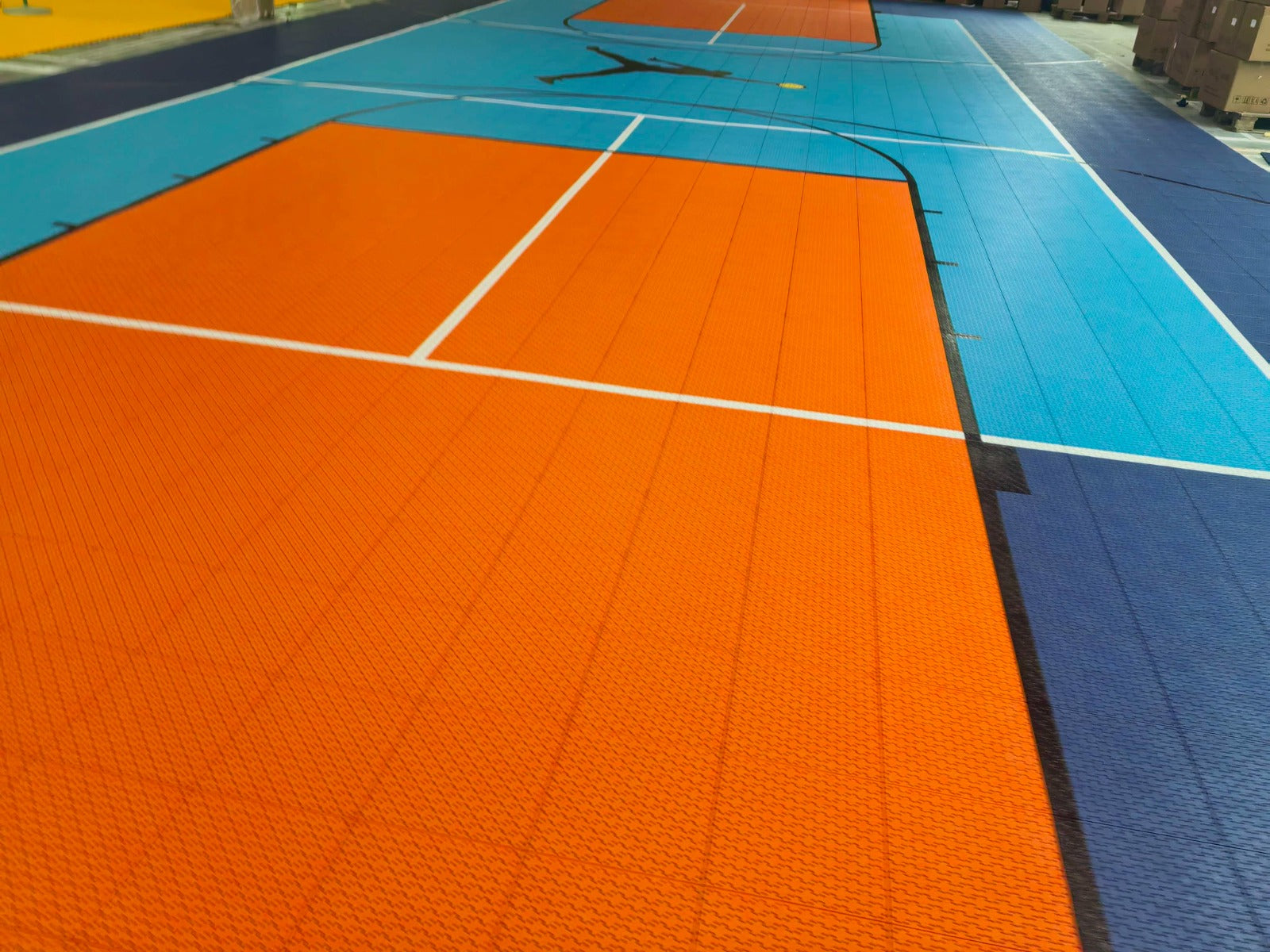Orange key and overlapping basketball and pickleball lines on the Jumpman court