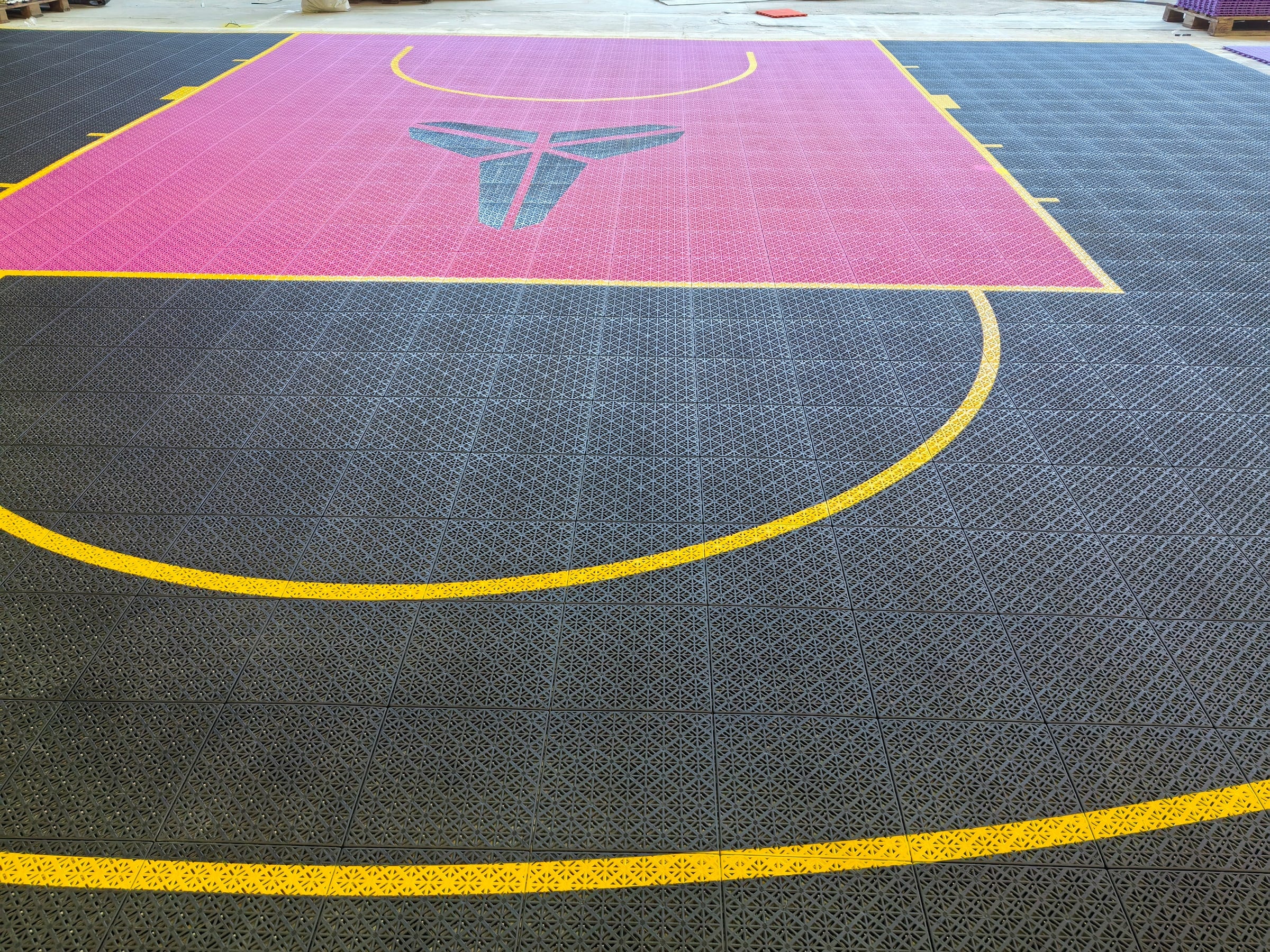 black pink and yellow Kobe-inspired one-hoop Elastic tile backyard basketball court in Belgium, project photo 2