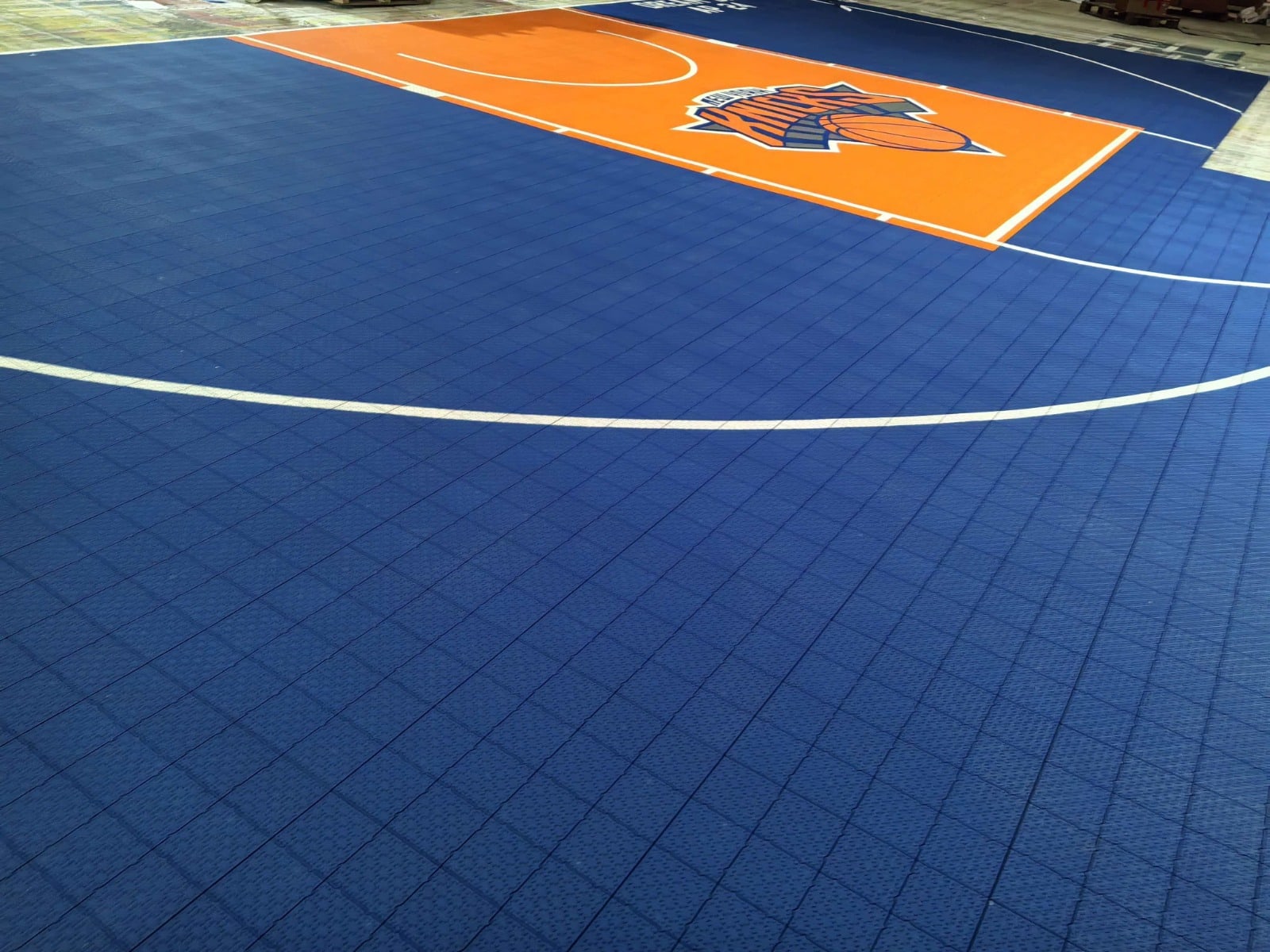 Blue and orange Texas Knicks-inspired Elite tile basketball court, project photo 1