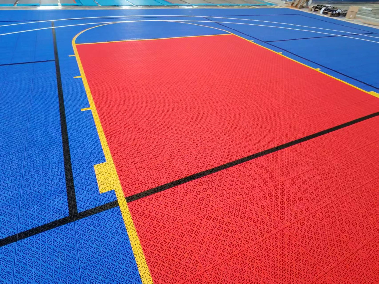 Red key and yellow basketball markings on the Missouri Elastic tile court, project photo 3