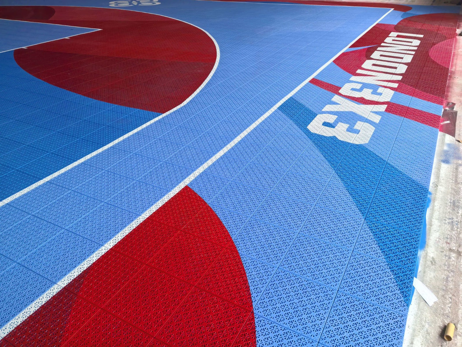 Red and blue London 3x3 Team Court with custom border branding