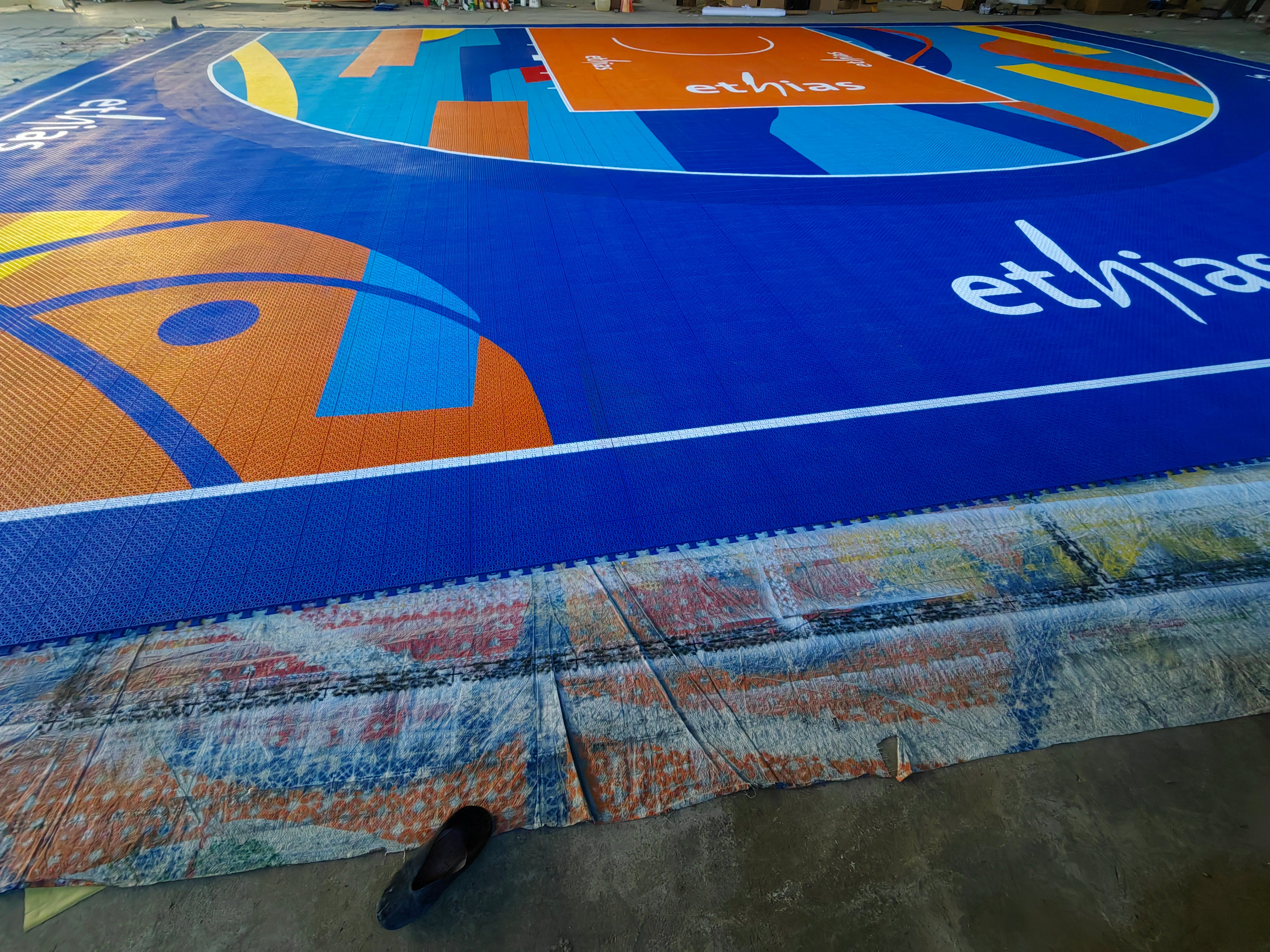 Ethias wordmark, basketball artwork, and the complete custom 3x3 court design
